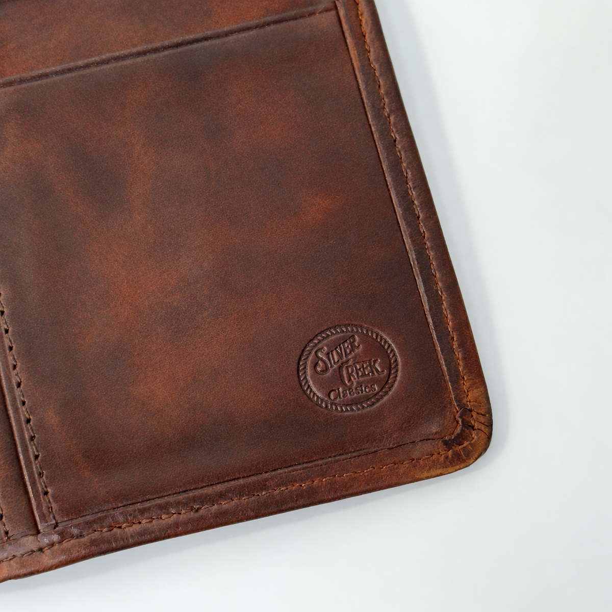 Silver Creek Classics brand stamp and leather wear detail