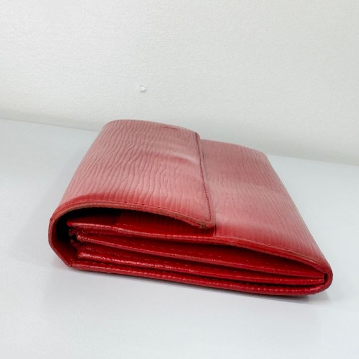 Louis Vuitton red Epi leather wallet folded side profile