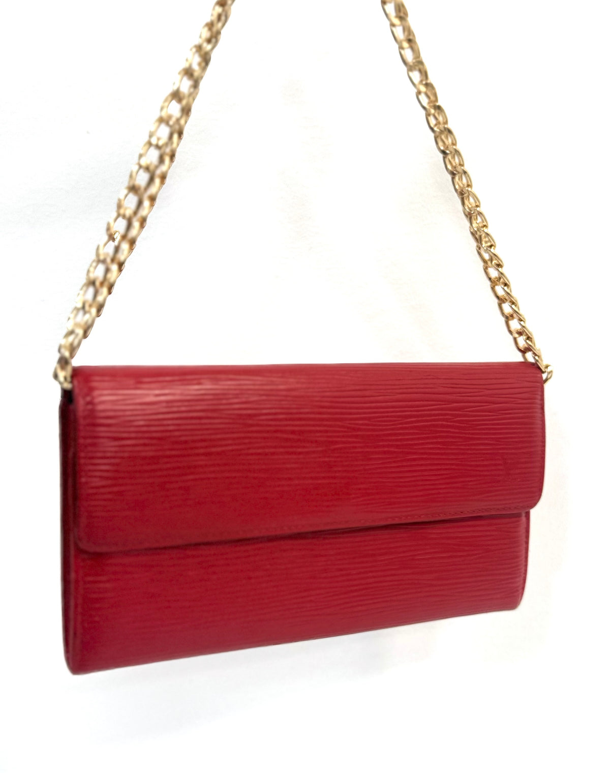 Louis Vuitton Epi wallet worn as a gold chain crossbody