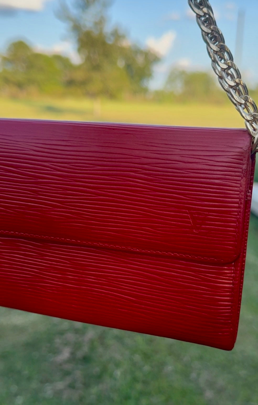 Louis Vuitton red Epi leather and chain detail
