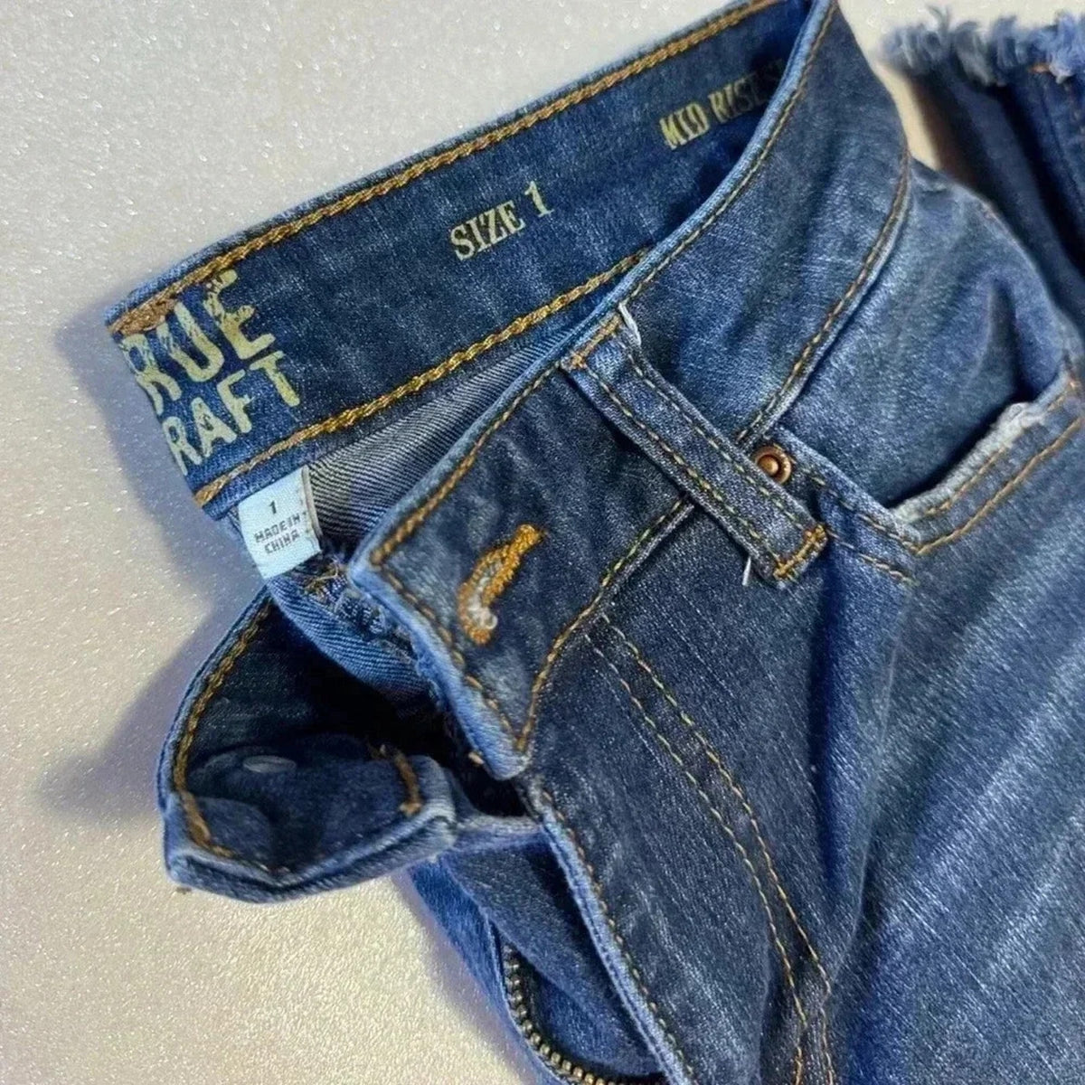 Mid-Rise Slim Flare Distressed Hem Jeans Juniors Size 1 Blue
